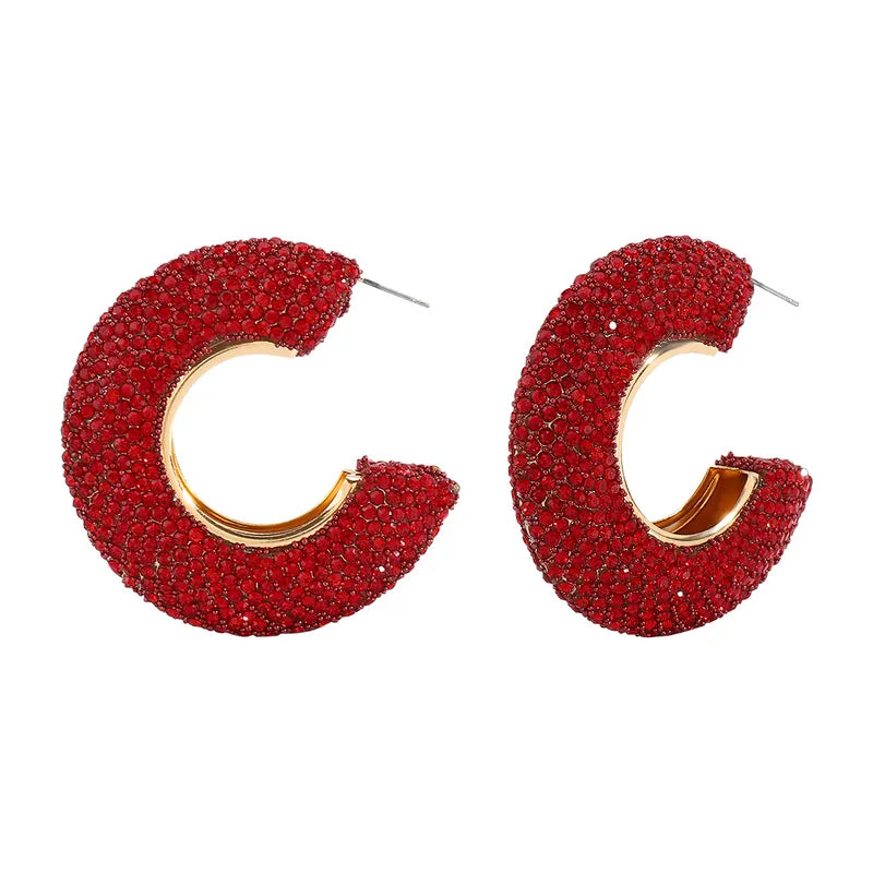 Red crystal-studded hoop earrings with gold-tone inner finish, contemporary design