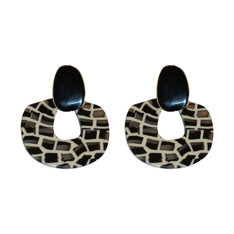 Black and white geometric resin earrings with abstract grid pattern, modern statement jewelry