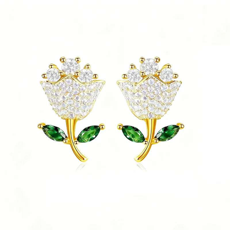 Rose-shaped 18K gold earrings with zircon stones and green leaf accents, classic floral design